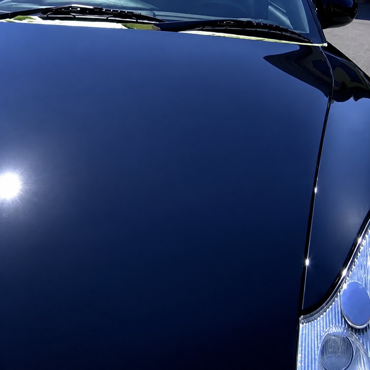 Black hood after paint correction and ceramic coating