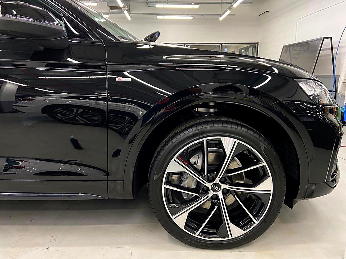 Gloss-black Audi under the strip lights in the CDS studio, Berwick